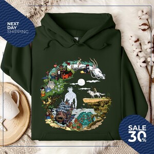 a green hoodie with a colorful illustration of a dragon, castle, and various other fantastical elements, along with a sale sign indicating a 30% discount.