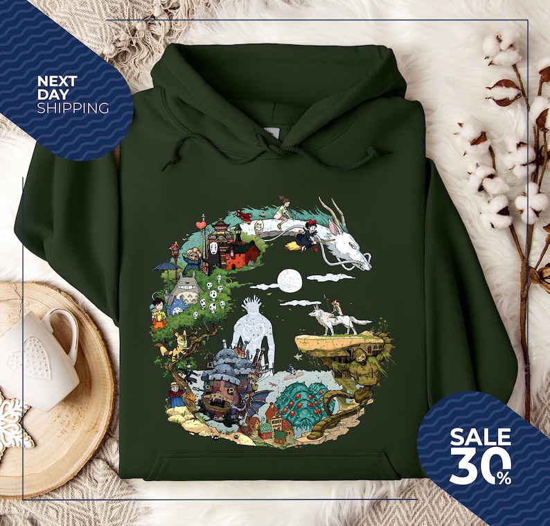 a green hoodie with a colorful illustration of a dragon, castle, and various other fantastical elements, along with a sale sign indicating a 30% discount.