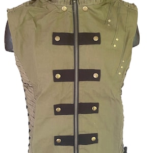 May include: A sleeveless green vest with a black zipper and black straps with gold buttons. The vest has a hood and is made of a textured fabric.