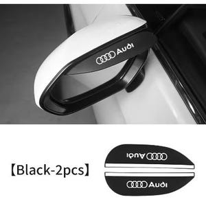 Puede incluir: Retrovisor lateral de coche blanco con un acento negro y el logotipo de Audi. La imagen también muestra dos calcomanías negras con el logotipo de Audi y el texto "Audi".