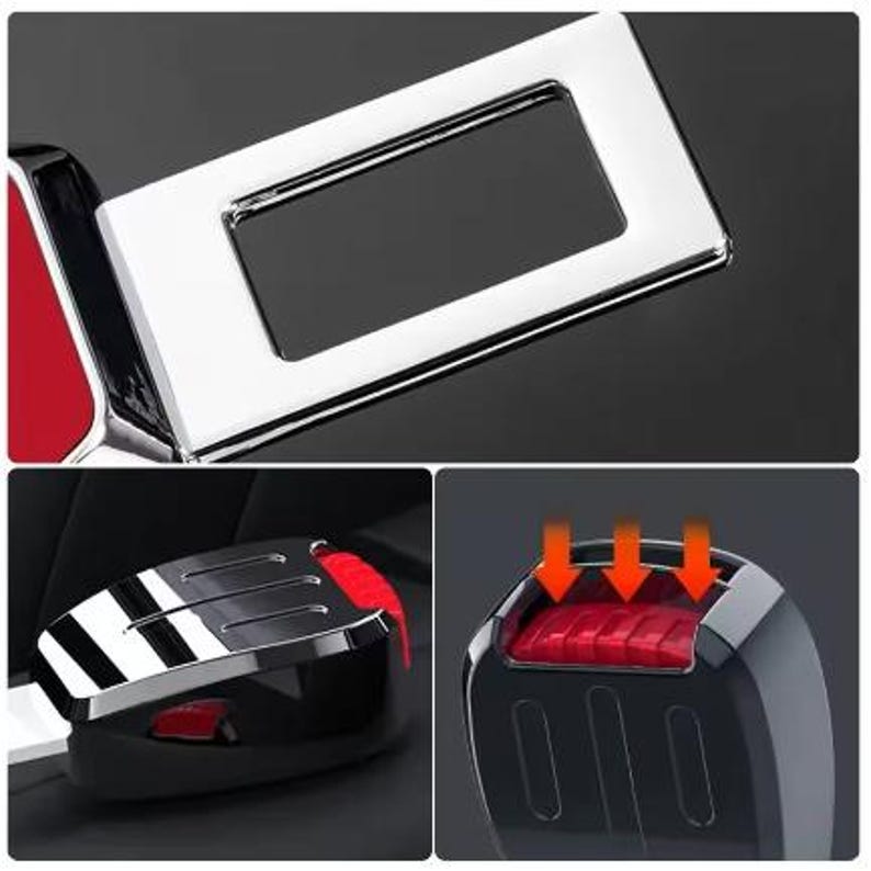 K&ouml;nnte beinhalten: Nahaufnahme einer Autosicherheitsgurtschnalle und des Entriegelungsmechanismus. Die Schnalle ist verchromt mit einer rechteckigen &Ouml;ffnung. Der Entriegelungsknopf ist rot. Der Mechanismus ist schwarz mit einem roten Knopf.