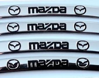 Juego de 4 pegatinas plateadas para llantas de metal (9 cm) con el logotipo de Mazda. Emblemas para el centro del cubo del coche.