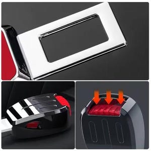 May include: Close-up of a car seat belt buckle and release mechanism. The buckle is chrome-plated with a rectangular opening. The release button is red. The mechanism is black.