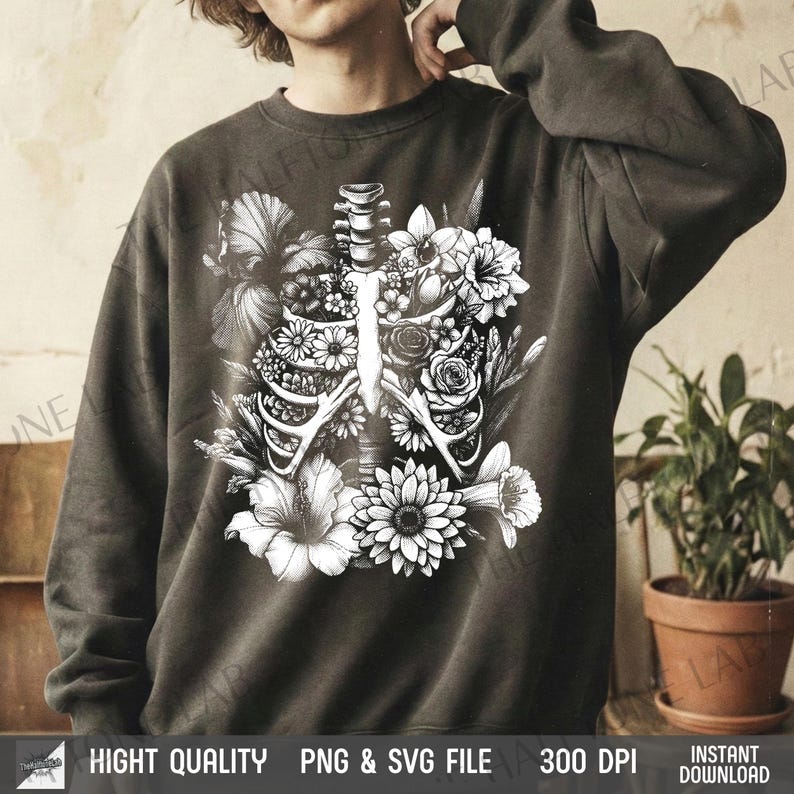 May include: Dark gray sweatshirt featuring a black and white floral design overlaying a rib cage. The design includes various flowers and foliage. The bottom of the image includes the text "HIGHT QUALITY PNG & SVG FILE 300 DPI INSTANT DOWNLOAD".
