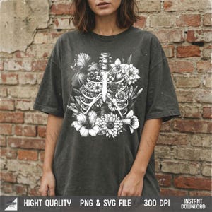 t-shirt hanging on brick wall with Skull Rose vintage design, rustic grunge streetwear.