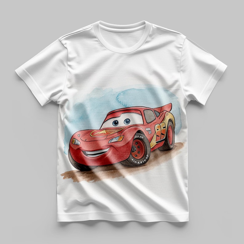 May include: White t-shirt featuring a watercolor illustration of Lightning McQueen from the Cars movie. The red race car has the number 95 on its side and is set against a blue and brown background.