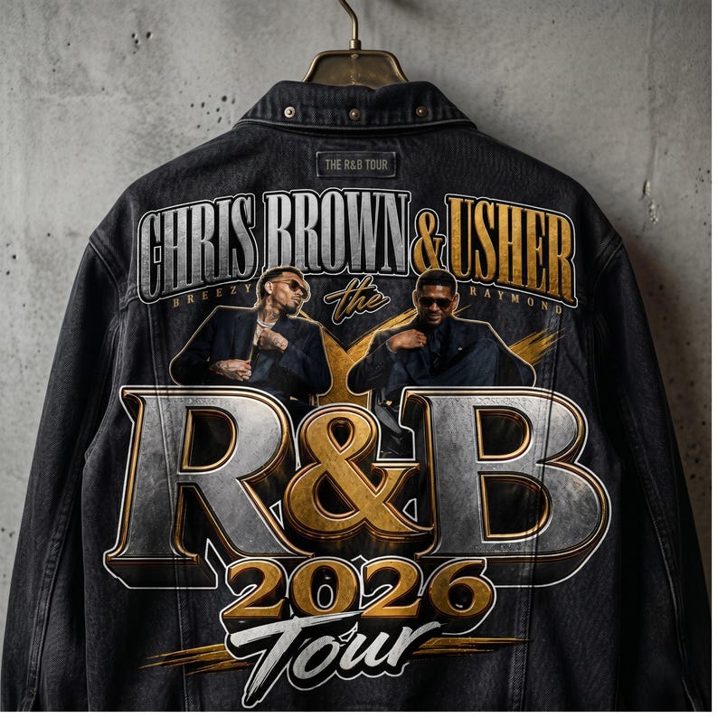 May include: Black denim jacket with a graphic design for the R&B Tour 2026 featuring Chris Brown and Usher. The design includes the text "CHRIS BROWN & USHER" above the words "R&B 2026 Tour". The jacket is suspended from a metal hanger.