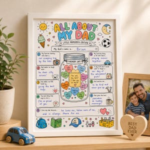 May include: A framed white poster titled All About My Dad Little Memories Edition with colorful hand-drawn illustrations including a sun, moon, soccer ball, and a central memory jar filled with heart-shaped notes and handwritten text.