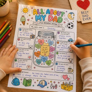 May include: A white paper activity sheet titled All About My Dad Little Memories Edition with colorful hand-drawn illustrations including a memory jar filled with hearts, a sun, a moon, a soccer ball, and a toolbox, featuring handwritten text.