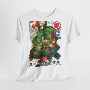 May include: White t-shirt featuring a green dragon illustration with orange orbs and Japanese text. The design includes the words "MASTERMIND" and "CAPSULE CORP." with a skull and crossbones on either side.