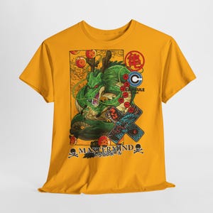 May include: Mustard yellow t-shirt featuring a green dragon illustration with red and gold accents. The design includes Japanese text and the words "MASTERMIND" and "CAPSULE CORP."