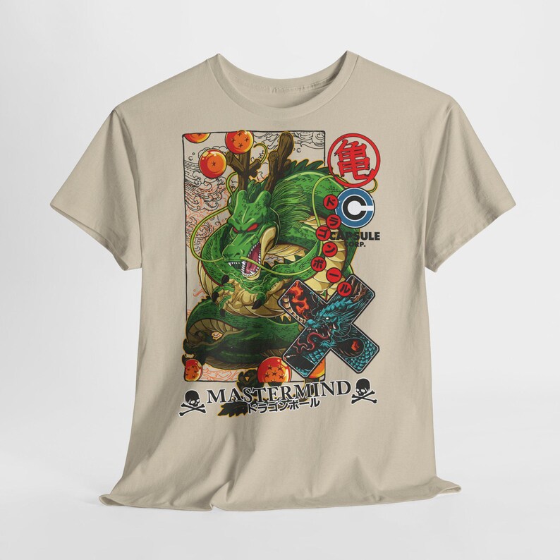 May include: A beige t-shirt featuring a green dragon illustration with the text "MASTERMIND" and Japanese text. The design includes orange orbs, a Capsule Corp logo, and a dragon graphic on a cross.