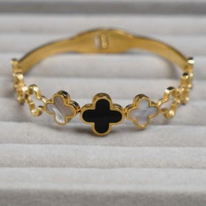 Elegant Gold Clover Bangle Bracelet | Black and White Botanical Design | Hinged Cuff | Clover Bracelet | Gift for Women | Minimalist Style.
