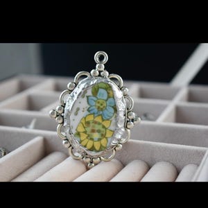 handmade pendant.  broken China jewelry.  made with solder metal. Upcycled China.
