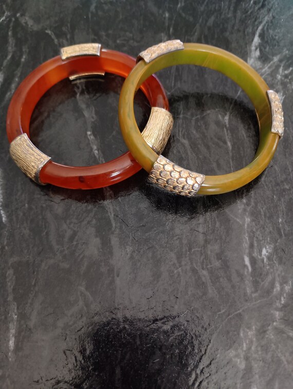 Pair Bakelite bangles with metal accents you get b