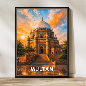 May include: A framed wall art print depicting a historic domed building in Multan, Pakistan, featuring intricate blue tile work, a grand staircase, and lush trees under a vibrant orange and blue sunset sky with the text MULTAN PAKISTAN.