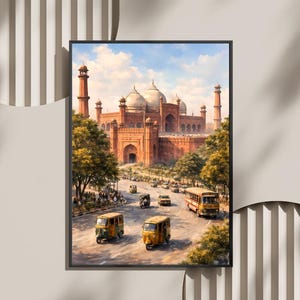 May include: Framed art print depicting a detailed watercolor painting of a grand, red-brick mosque with multiple domes and minarets. The artwork features a busy street scene with yellow buses and auto rickshaws, set against a blue sky.