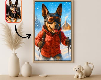 May include: A framed art print depicts a dog wearing ski goggles and a red jacket, skiing in a snowy landscape. The artwork includes a smaller image of the dog. The print is displayed on a wooden surface with decorative vases and a small dog figurine.