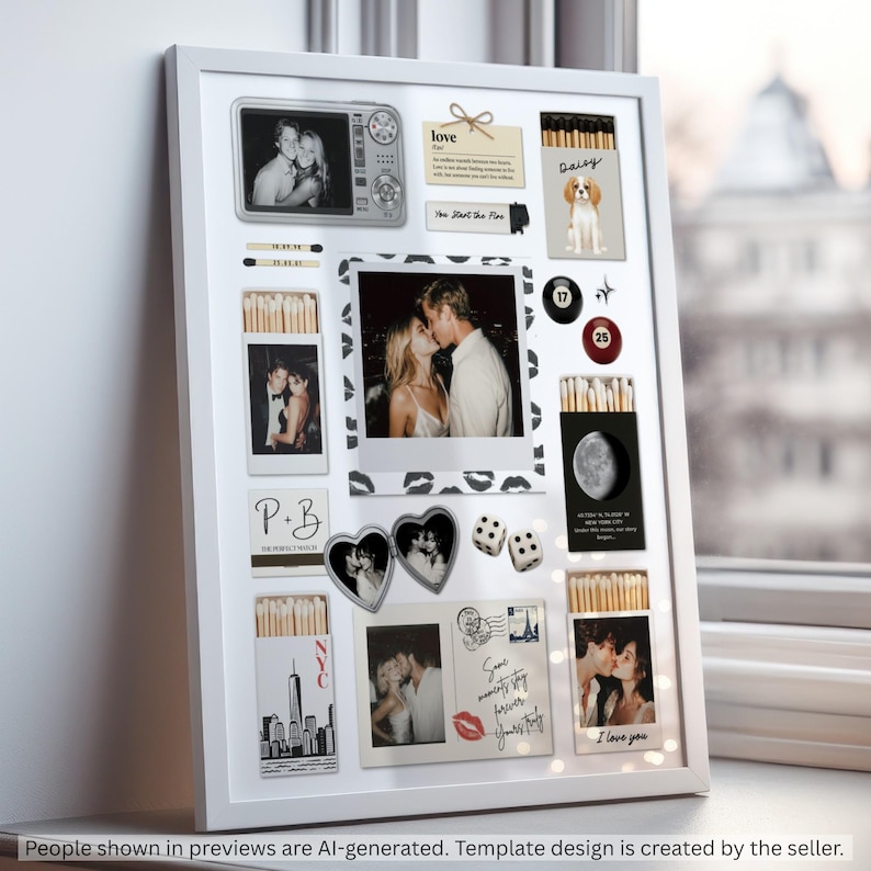 May include: A white framed shadow box display featuring a collection of personal mementos including several matchboxes, a heart-shaped locket, two dice, billiard balls, and multiple photographs of a couple. The display includes text elements like love, NYC, and various dates, arranged on a white background with a black lip print border.