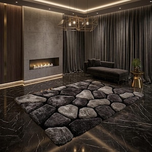 May include: A rectangular area rug featuring a textured, shaggy pile with a pattern of irregular, stone-like shapes in varying shades of charcoal, slate grey, and light silver, arranged to resemble a mosaic of river rocks on a dark floor.