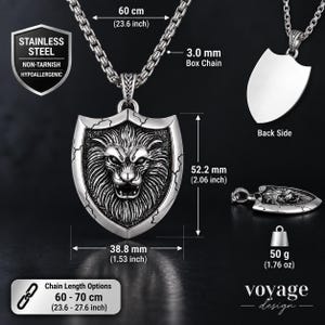 May include: A stainless steel lion shield pendant on a 3.0 mm box chain. The pendant measures 52.2 mm by 38.8 mm and weighs 50 g. The chain length is 60 cm (23.6 inches), with options up to 70 cm (27.6 inches). Text includes STAINLESS STEEL.