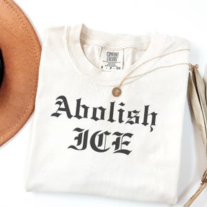 Floral Abolish ICE Human is Illegal Shirt, Political Resistance Shirt, Anti-Trump Activist Wear, No Human is Illegal Top, DACA Shirt VLB1026