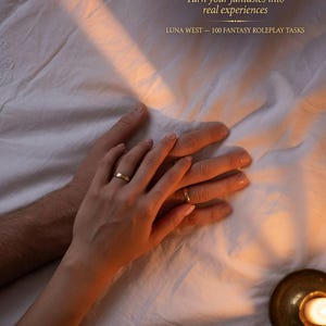 Puede incluir: La imagen muestra dos manos, una masculina y otra femenina, con anillos dorados, descansando sobre una s&aacute;bana blanca. El texto "STOP WONDERING. START EXPLORING." est&aacute; en la parte superior, con "Turn your fantasies into real experiences" debajo. "LUNA WEST - 100 FANTASY ROLEPLAY TASKS" est&aacute; en la parte inferior.