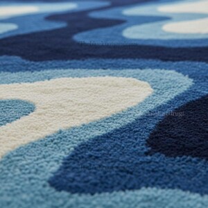 Hand-tufted wavy pattern rug in an irregular organic shape; ocean blue to navy blues with white cream, a textured plush melting rug.