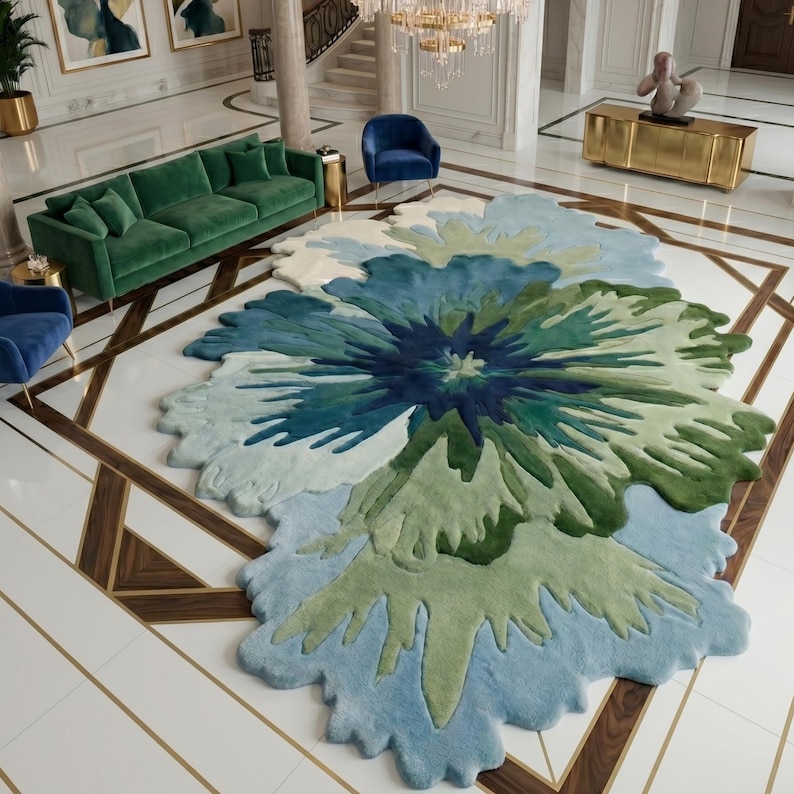 May include: A large, floral-shaped rug in shades of blue, green, and white. The rug's design resembles a stylized flower, with layered petals in varying tones. The rug is placed on a tiled floor with a geometric pattern. The rug is a focal point.