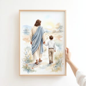 May include: A watercolour art print depicting a long-haired figure in a cream robe with a blue drape walking hand-in-hand with a young child in a white shirt and tan trousers along a path through a field of wildflowers towards a bright sun.