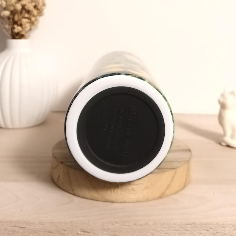 May include: A set of three ceramic mugs with a speckled, matte finish. The mugs are in shades of cream, light gray, and dark gray. Each mug has a simple, minimalist design, perfect for coffee or tea.