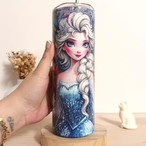 May include: A set of three ceramic mugs with a speckled, matte finish. The mugs are in shades of cream, light gray, and dark gray. Each mug has a simple, minimalist design and a rounded handle.