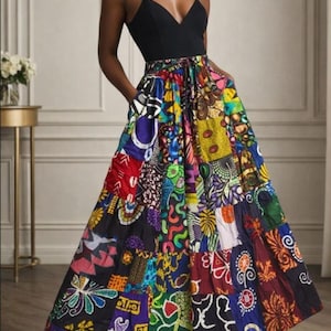 May include: A black spaghetti strap top paired with a vibrant, patchwork maxi skirt. The skirt features a variety of colorful patterns and designs, including floral and geometric motifs. The skirt has pockets and a flowing silhouette.