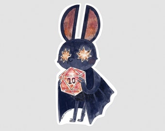 May include: A cartoon bat with a black body and brown ears holds a red twenty-sided die with a white ten on it. The bat has star-shaped eyes.