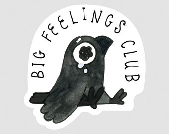 May include: A black and white sticker with a cartoon bird with a large eye and the text "BIG FEELINGS CLUB".