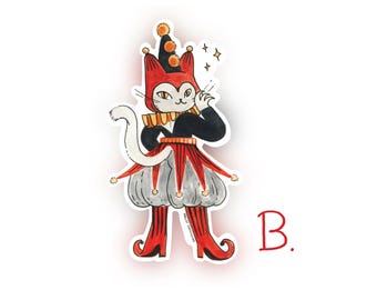 May include: A sticker featuring a whimsical cat dressed as a jester. The cat wears a red and black outfit with a ruffled collar and a matching hat. The cat's gray face has yellow eyes and a white tail. The sticker has a white border and the letter "B."