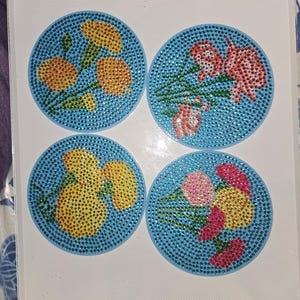 Juego de 4 posavasos con flores
