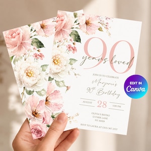 Op de afbeelding: Een witte verjaardagsuitnodigingskaart met aquarel roze en witte bloemenillustraties. De tekst luidt 90 years loved, Join us to celebrate, Marjorie's 90th Birthday, August 28, 1:00 PM, Olivia's Bistro, 12 Park Lane, NY 10019, RSVP to Laura at (315) 367 2357.