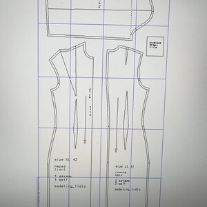 May include: A digital image of a dressmaking pattern displayed on a computer screen. The pattern includes various pieces labeled with sizes XL 42 and L 32, along with text in a foreign language. The pattern is on a grid.