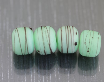 4 Green lampwork beads. Lampwork glass bead pairs for earrings. Handmade matte beads Cocoon beads green and black beads by Anne Londez SRA