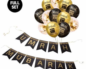 Puede incluir: Un juego completo de decoraciones para fiestas de Umrah Mubarak. El juego incluye banderines negros y dorados y globos. Los globos son dorados, negros y transparentes con confeti dorado. Los globos tienen la palabra "Umrah" y un gráfico de un edificio.