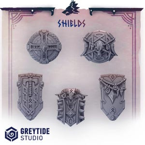Könnte beinhalten: Eine Sammlung von fünf grauen Fantasy-Schilden mit aufwendigen Designs. Die Schilde variieren in der Form und weisen Runen, Schädel und andere dekorative Elemente auf. Das Wort "SHIELDS" wird über den Schilden angezeigt, und das GreyTide Studio-Logo befindet sich unten.