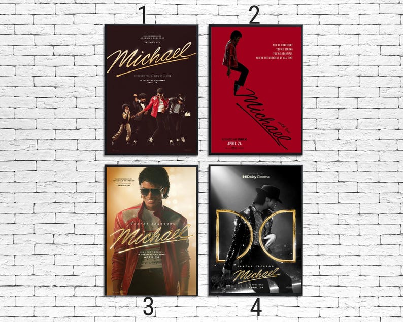 May include: Four framed posters featuring Michael Jackson. The posters have different designs, including images of Michael Jackson in various poses and outfits. The posters are against a white brick wall. The posters have the word "Michael" in gold script.