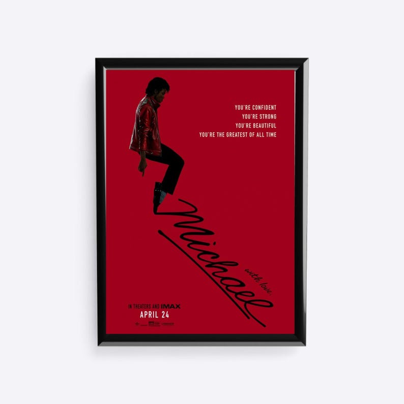 May include: Framed poster with a red background featuring Michael Jackson in a red jacket and black pants. The poster includes the text "Michael" in cursive, along with the phrases "You're Confident," "You're Strong," and "You're Beautiful."