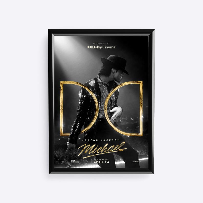 May include: A framed movie poster for "Michael" featuring Jaafar Jackson. The black and white image shows Jackson in a sequined jacket and fedora. Gold-colored "D" and "C" letters are overlaid on the image. The poster includes the text "Discover it at Dolby Cinema" and "In Theaters April 24".
