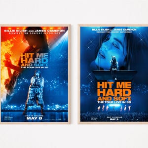 May include: Two framed posters advertising "HIT ME HARD AND SOFT: THE TOUR LIVE IN 3D" by Billie Eilish and James Cameron. The posters feature concert imagery and the date "MAY 8".