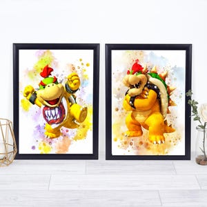 May include: Two framed watercolor prints featuring Bowser Jr. and Bowser from the Super Mario series. The characters are depicted in vibrant yellow, green, and red hues against a colorful splatter background. The frames are black.