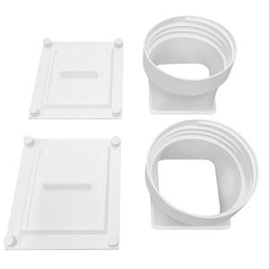 May include: Four white plastic components. Two are rectangular with a recessed center and four rounded corner posts. The other two are curved, with a circular opening and a square base. All components are white.