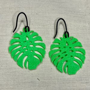 Monstera tropische bladoorbellen