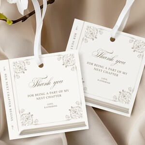 May include: Two ivory-colored gift tags with the text "Thank you" and "For being a part of my next chapter". Each tag has a decorative border and a white ribbon. The text "Love, Katherine" is also present.